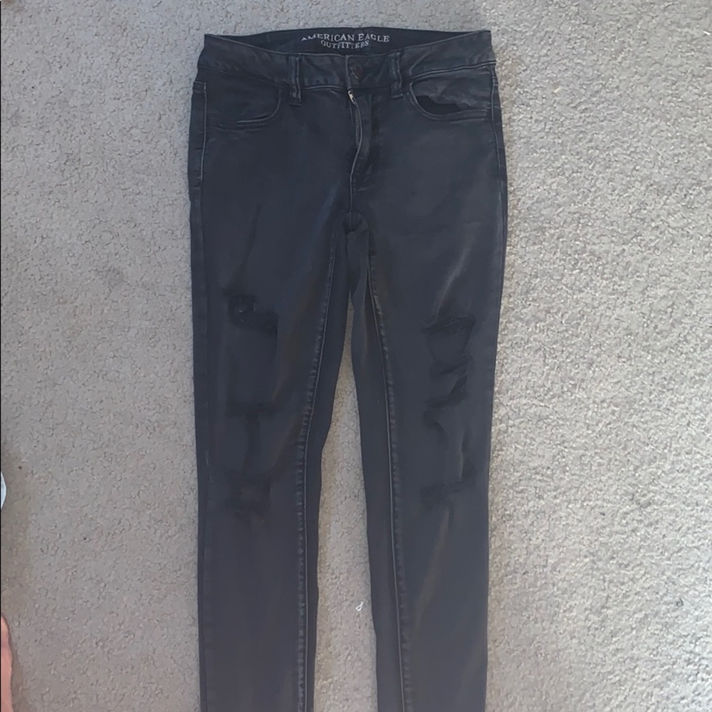 Distressed black jeans.
